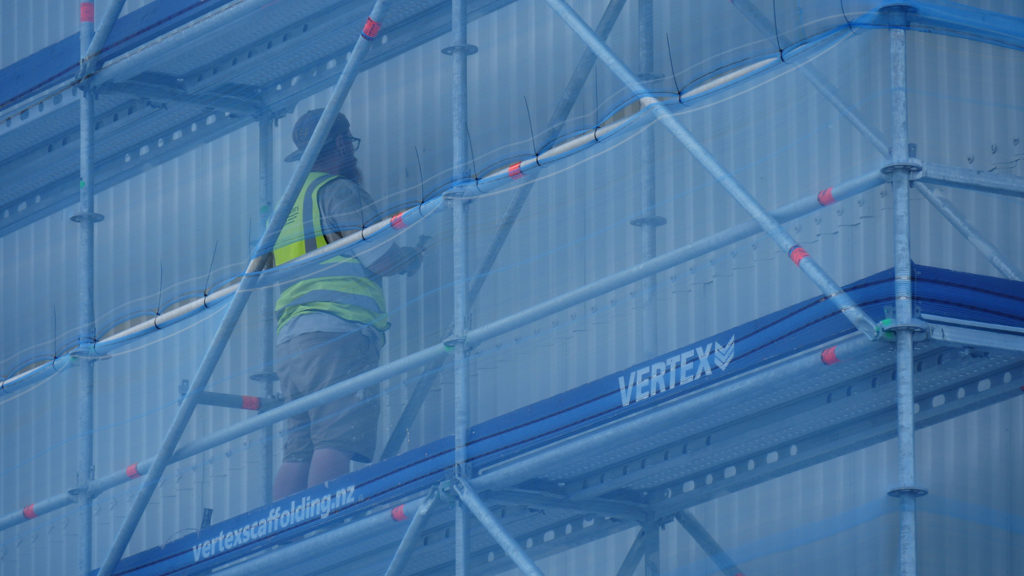 Painter preparing surface for new sign