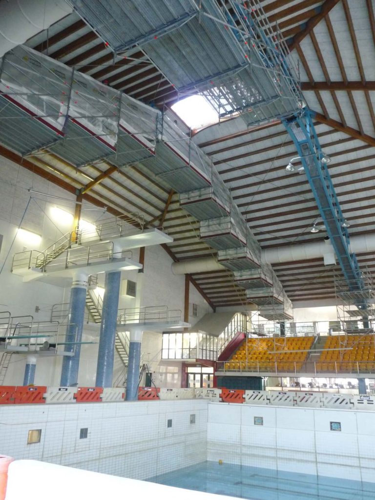 Maintenance scaffolding spans over swimming pool