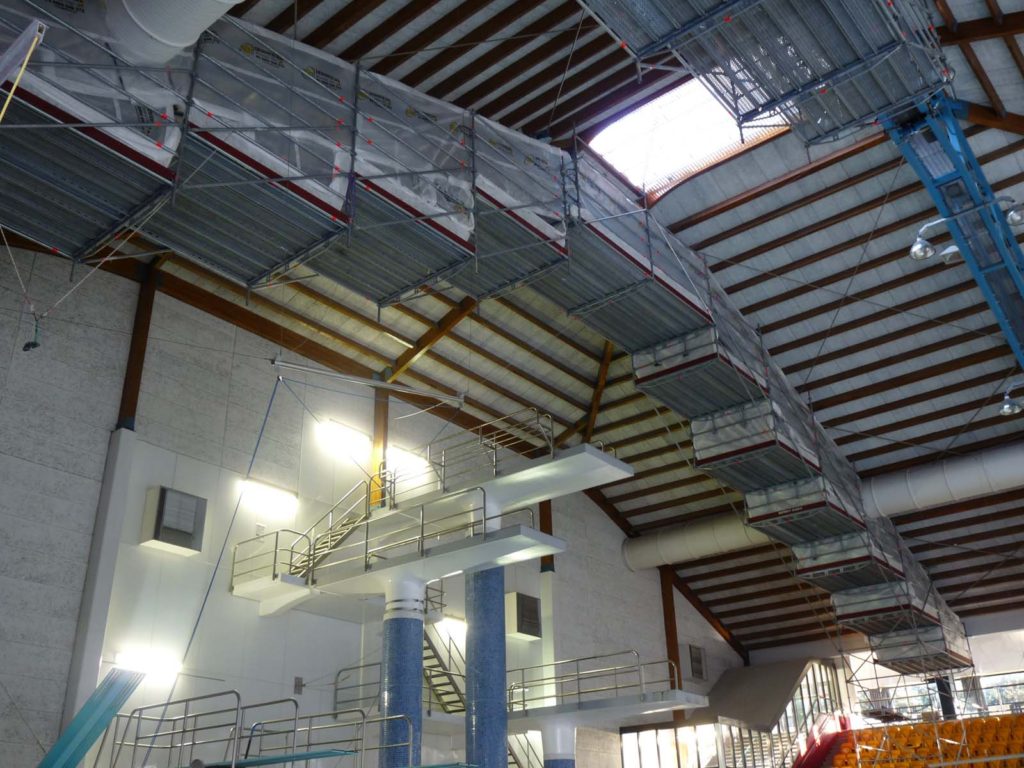 Scaffolding providing access to roof trusses over swimming pool