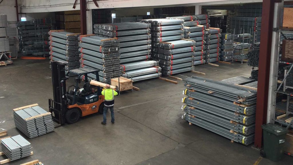 Layher's Wellington yard full of scaffolding supplies for sale